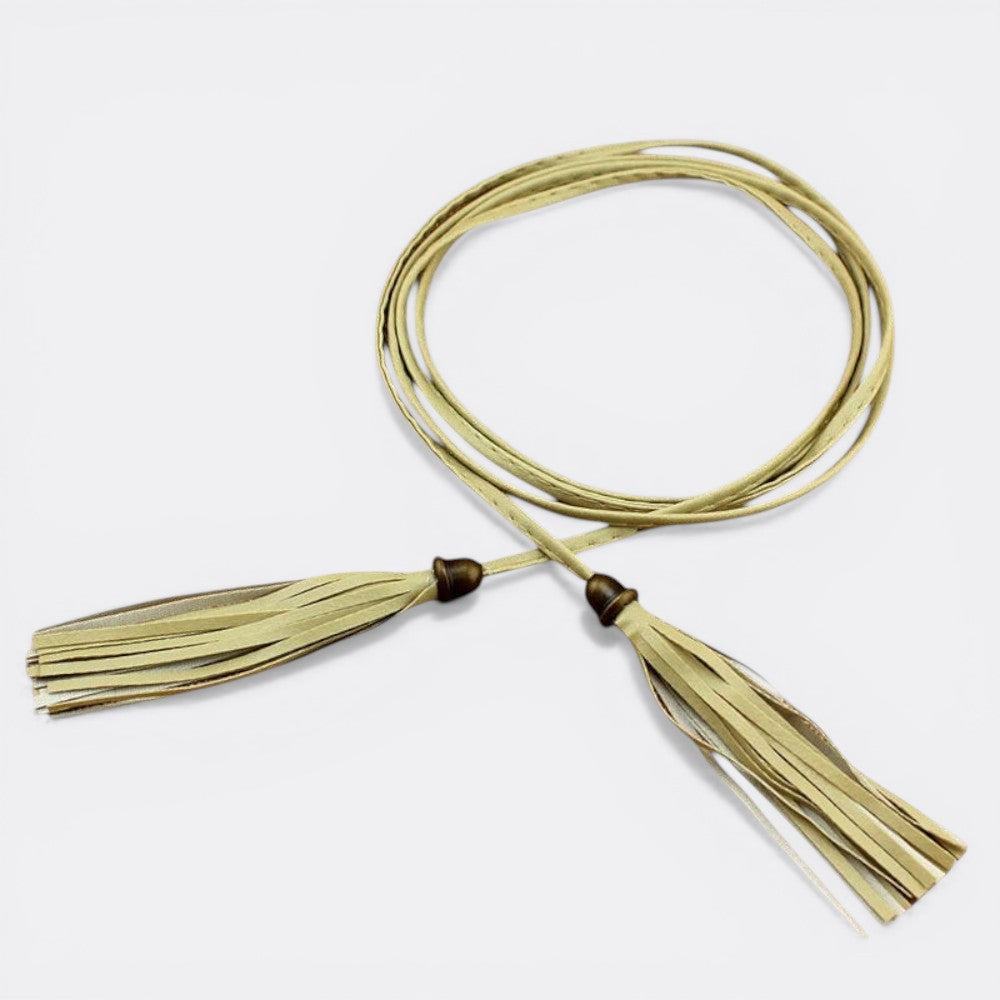 Le monde de la ceinture light beige cord belt with tassels and antique brass hardware. Adjustable tie closure.