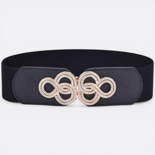 Le monde de la ceinture black elastic belt with gold knot buckle and faux leather trim, accentuating the waist.
