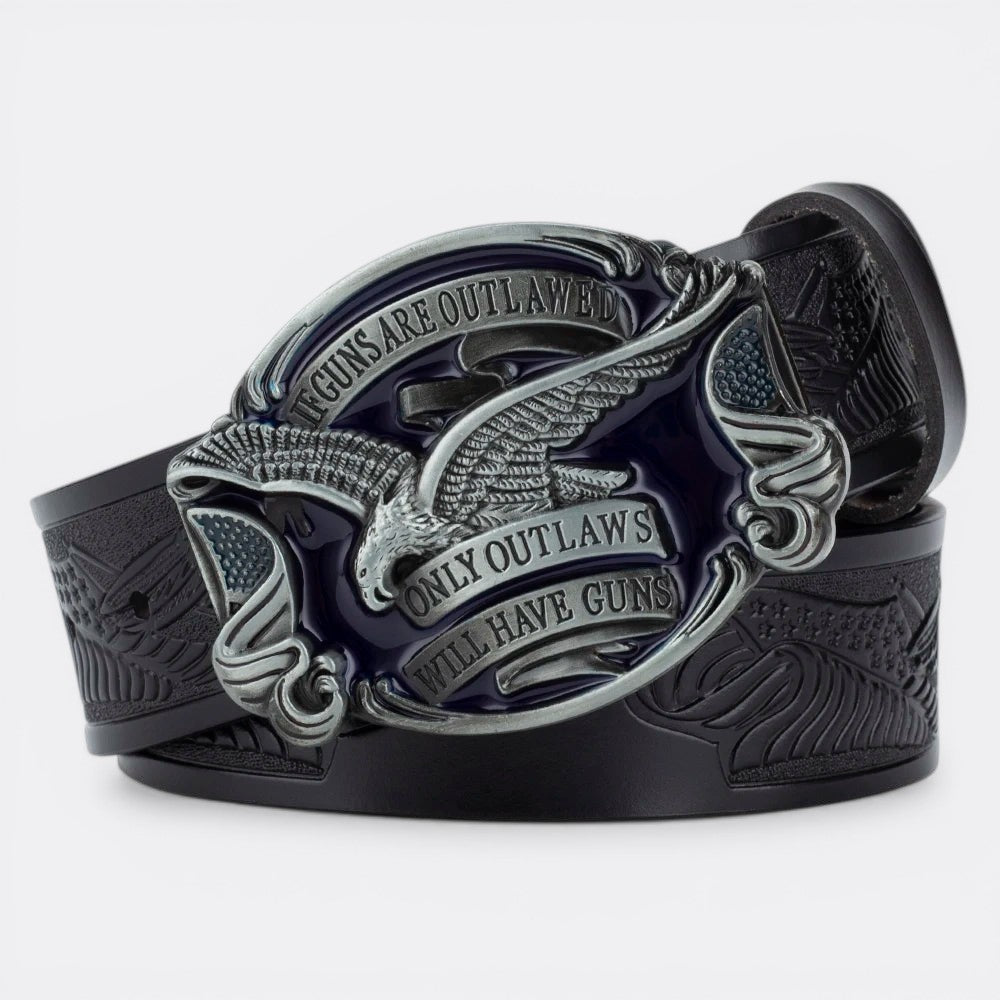 Le Monde de la Ceinture black leather belt with large silver and blue buckle featuring an eagle and American flag motif with text.