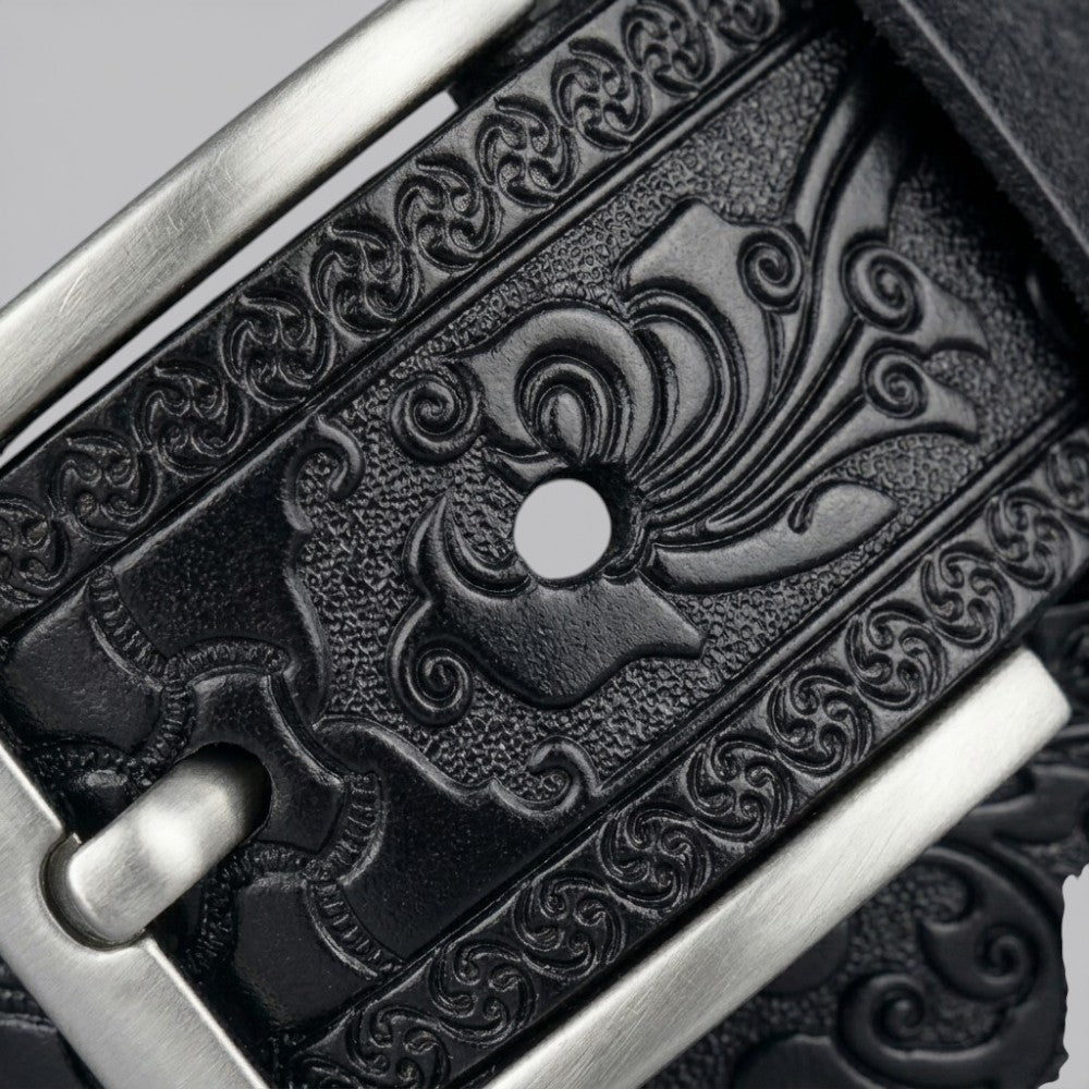 Le monde de la ceinture black leather belt with intricate tribal embossed pattern and silver buckle.