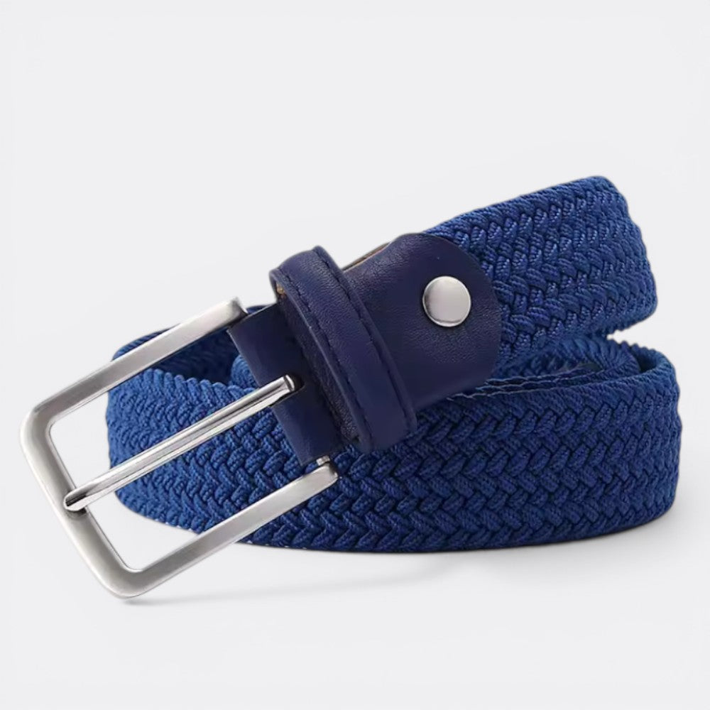 Le monde de la ceinture blue woven elastic belt with silver buckle and navy leather details.