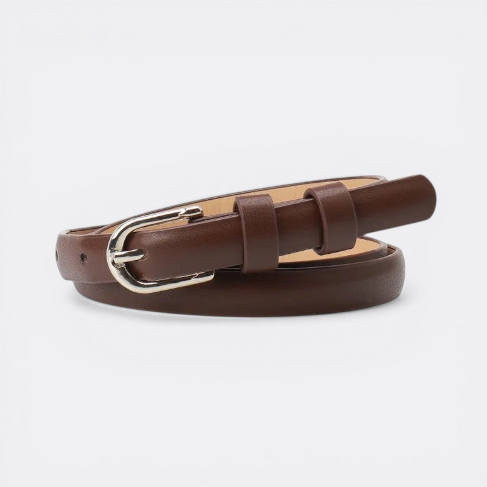 Le monde de la ceinture brown leather skinny belt with silver buckle, perfect for cinching dresses and jeans.