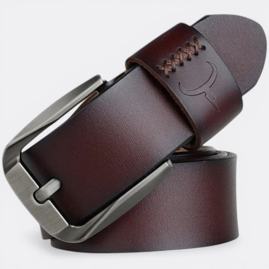 Le monde de la ceinture men's dark brown leather belt with a silver buckle and embossed bull logo.