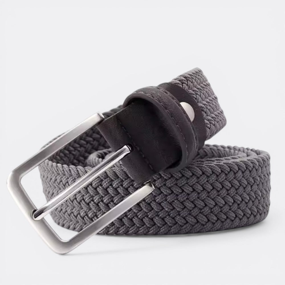 Le monde de la ceinture grey woven elastic belt with silver buckle and dark leather details.