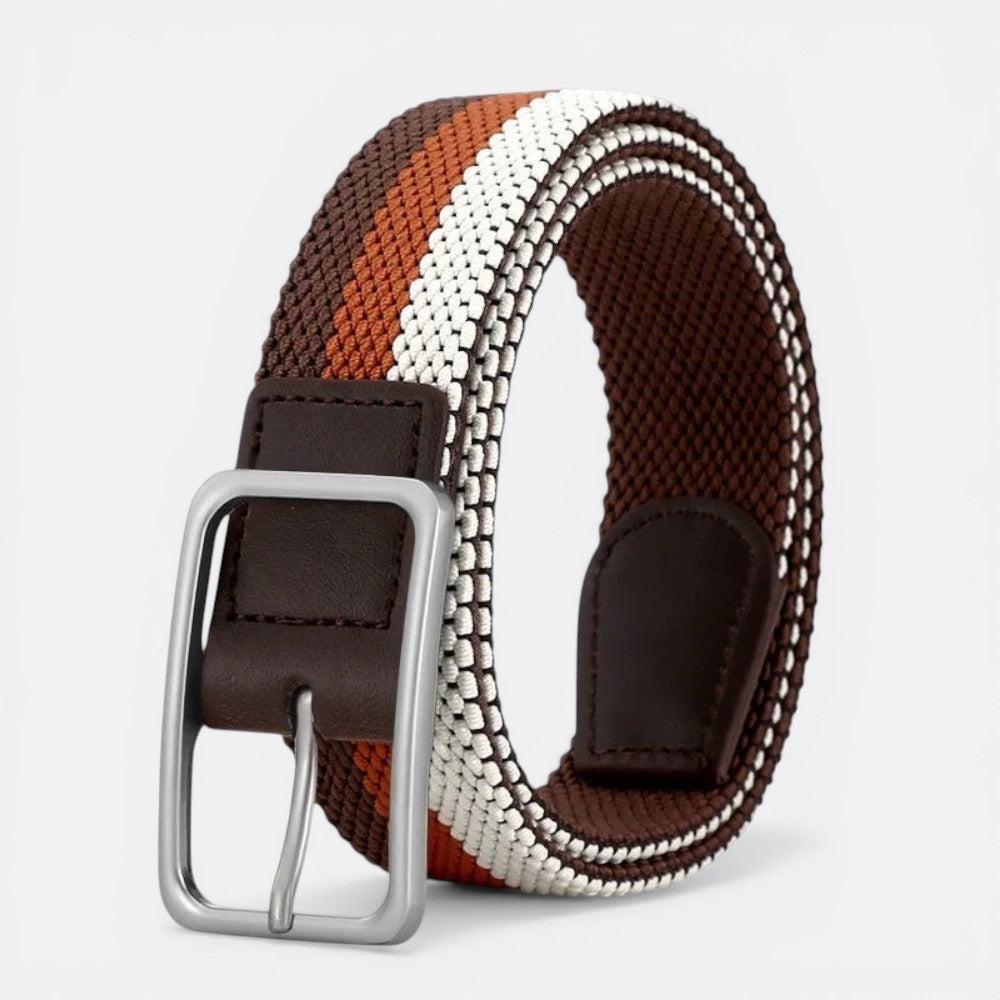 Le monde de la ceinture striped woven belt with brown, orange, and white stripes and a silver buckle.